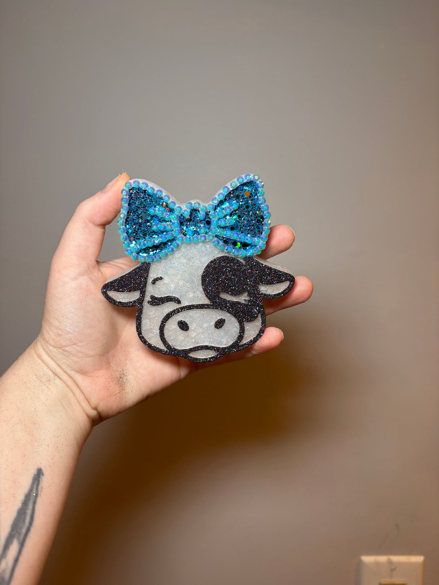 Cow with blue bow
